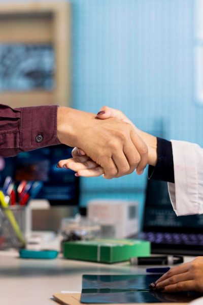 indian-physician-patient-shaking-hands-medical-consultation_482257-123877.jpg